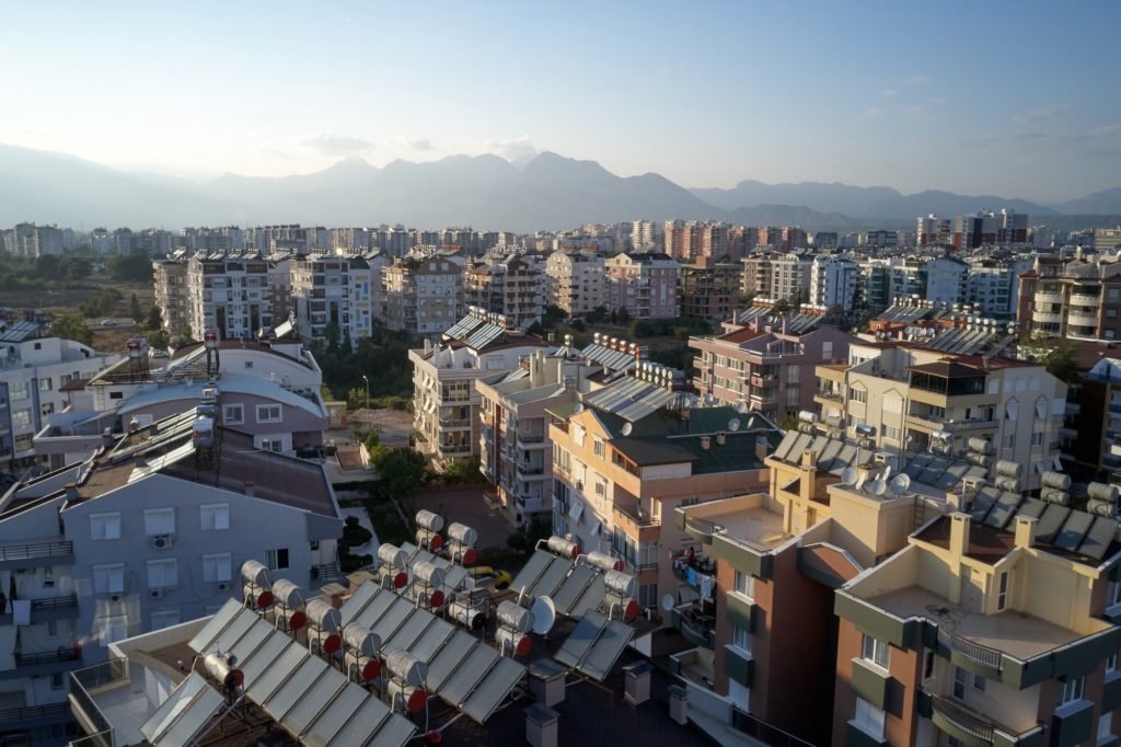 Urban landscape with views of multi-storey colored houses.