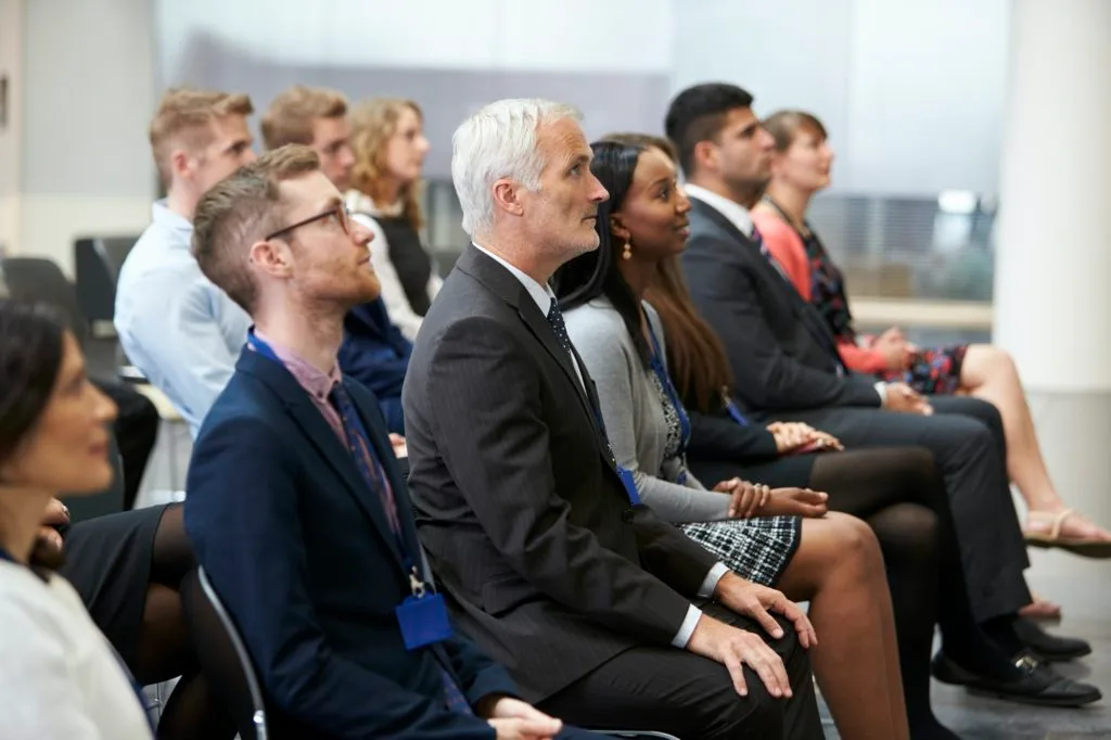 Audience Listening To Speaker At Conference Presentation