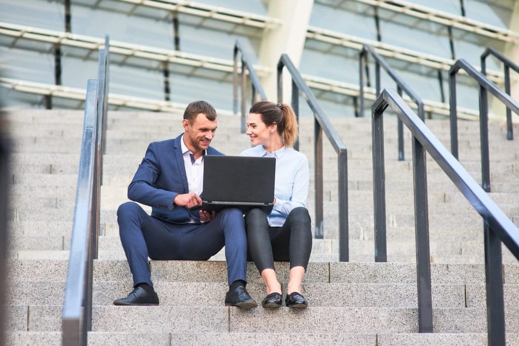 Business couple with laptop